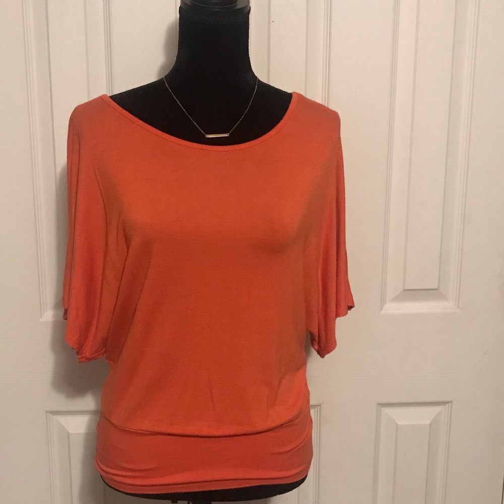 Awesome orange 🍊 open back form fitting top